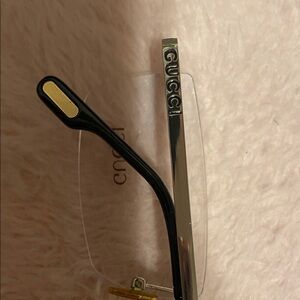 Gucci Black and Gold Rimless Eyewear
